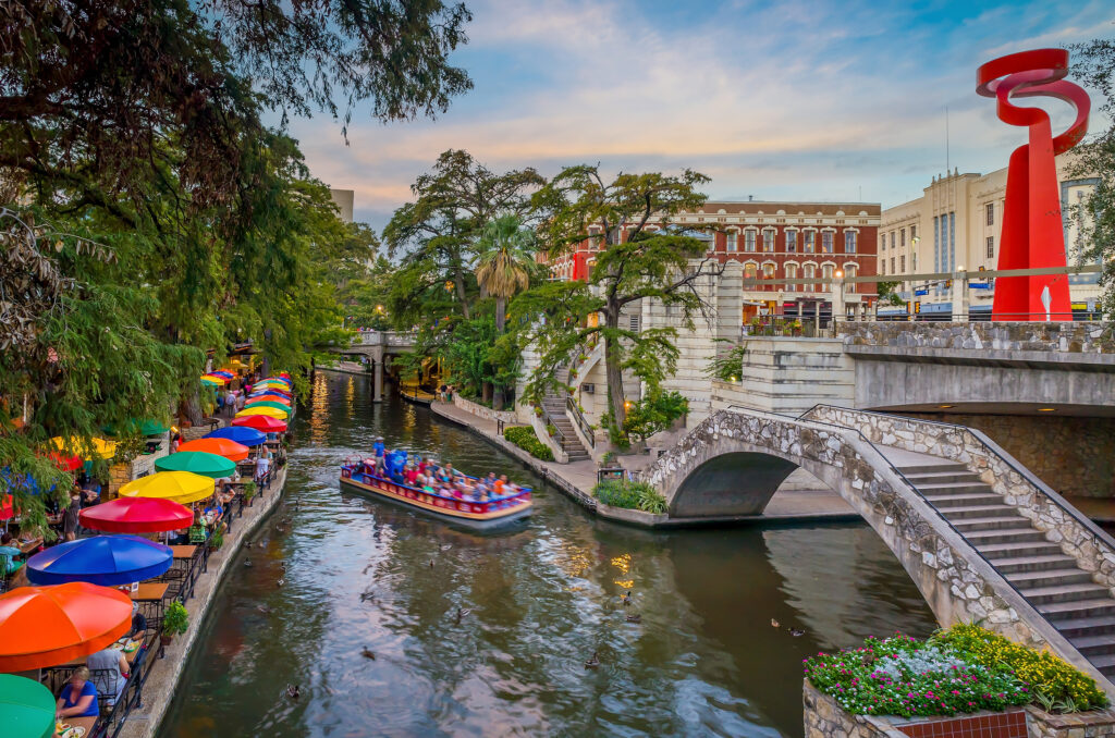 River walk in San Antonio city downtown skyline cityscape of Texas USA